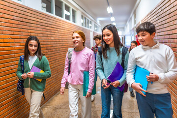 Students walking in school hallway between classes
