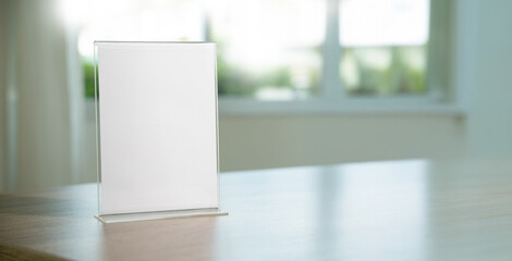 Stand Mock up Menu frame tent card blurred background design key visual layout in cafe.