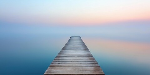 Naklejka premium A wooden pier with a calm body of water in the background. The water is a deep blue color and the sky is a light blue color. The pier is empty and there is no one in the scene
