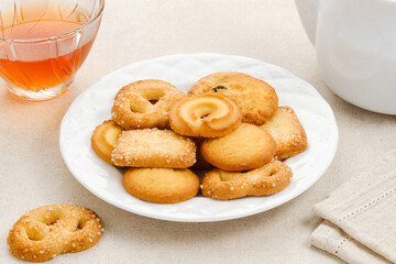Assorted of danish butter cookies, served on a white plate.
