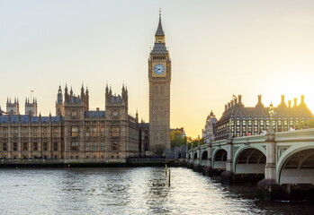 Houses of Parliament with Big Ben tower and Westminster bridge at sunset, London, UK