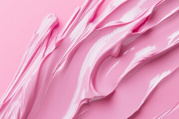 Photo of Fresh lip gloss smears of matt pink color. Detailed photo textured background