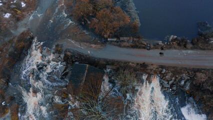 water flood destroying asphalt road dirt outskirts disaster space aerial photography