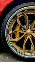 gold disk on a red race car