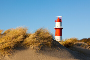 small lighthouse in the dunes at German North Sea island of Borkum