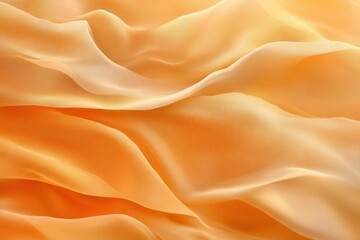 Obraz premium Soft orange silk fabric texture with flowing folds, ideal for backgrounds in design, fashion, and seasonal themes