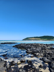A view of the sea and granite in Jeju Island, Korea