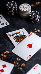 captivating scene featuring playing cards, poker chips, and floral accents