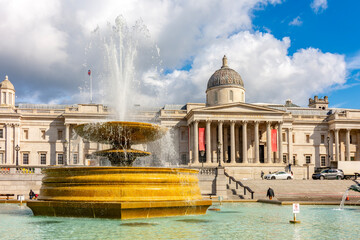 Fountain on Trafalgar square and National Gallery, London, UK