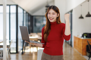Excited happy asian female feeling euphoric celebration online win success achievement result, about good email news, motivated by great offer or new opportunity, passed exam, got a job