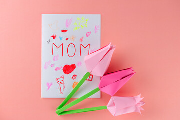 Paper tulips with a postcard with the inscription 