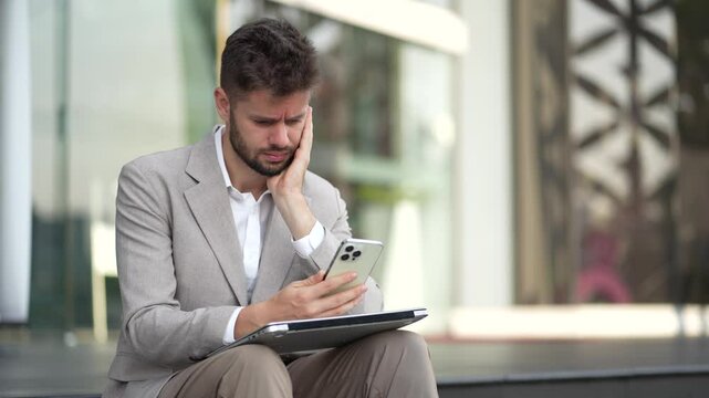 Concept of business failure and unemployment problem, unemployment stress businessman sitting on stairs.