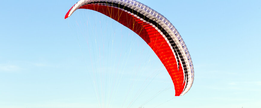 Parachute wing against blue sky