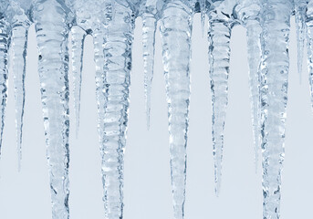 Hanging icicles with detailed frozen texture winter weather elements isolated on plain background