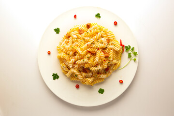 Isolate plate of spaghetti and pasta with tomato sauce