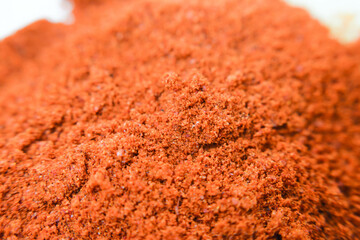 Red paprika powder isolated on white background. Spices and food ingredients. Red pepper powder in...