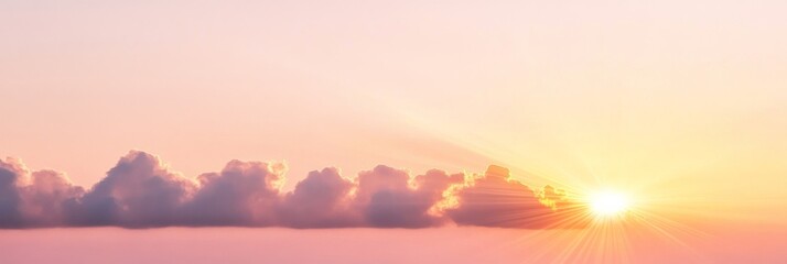 Fototapeta premium Elegant Golden sunrise clouds with streaks of orange and pink bursting across a pale morning sky inspirational and uplifting 