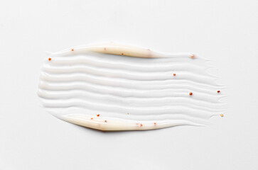 A sample of a cosmetic body care scrub. White background.