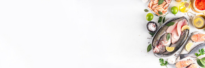 Variety raw fish and seafood background. Fresh fish, shrimps, mussels, caviar assortment flat lay, fish sale and market template