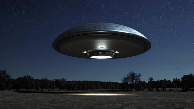 A low-angle shot of a UFO hovering over a field at night, casting a spotlight on the ground. The video style is cinematic and mysterious.
