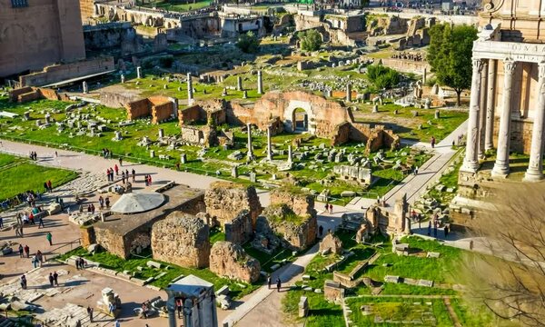 Rome Forum, camera flying  abate the ancient archaeological site with temples and administrative buildings ruins 