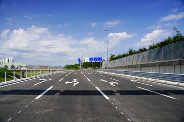 New Highway Ramp Leading to Roundabout with Fresh Road Markings