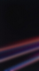 Soft diagonal light streaks in red, purple, and blue on a dark background. Perfect for wallpapers and modern designs
