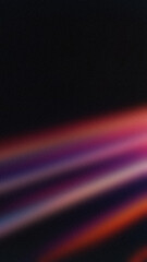 Blurred diagonal light streaks in red, orange, and purple on a dark background. Ideal for wallpapers and creative designs.