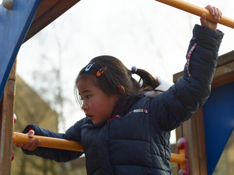 little girl playing on playground