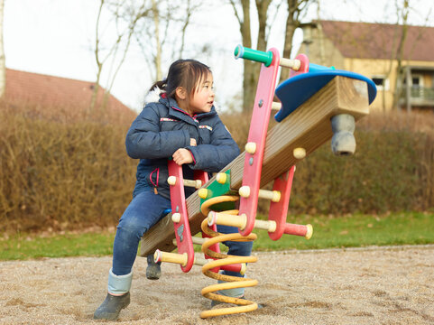 little girl playing on playground