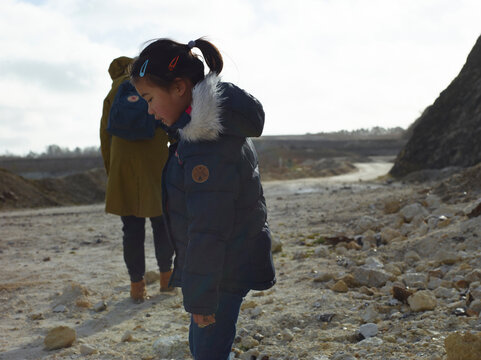 mother and daughter hiking in mountain