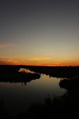 Obraz premium sunset over the river