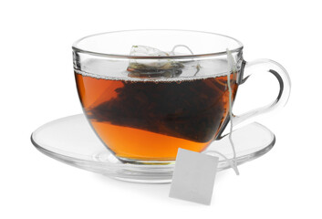 Tea bag in glass cup with hot drink isolated on white