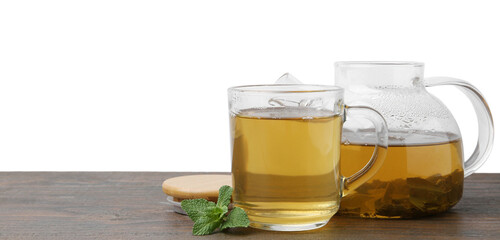 Aromatic mint tea and fresh leaves on wooden table against white background, space for text