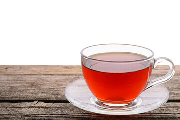 Refreshing black tea in cup on wooden table against white background