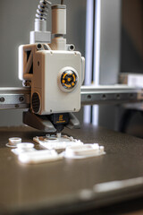 3D printer prints small parts. Prototyping concept