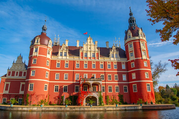 Schloss Muskau, Muskau palace, Saxony, Germany. UNESCO World Heritage Site. Autumnal landscape at the Prince Pückler Park, Bad Muskau. Palace on the lake. Reflection in water