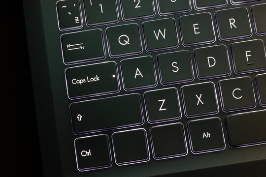 Caps Lock key on laptop close up. International Caps Lock Day