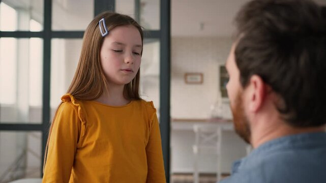 Caring Caucasian guy man parent touching offended frustrated little girl schoolgirl child quarrel dad male supporting frustrated daughter at home father comfort little kid family problem fatherhood