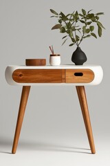 Modern minimalist table with wooden legs, decorative vase, and greenery in a soft neutral background