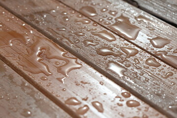 Large raindrops accumulated on a garden bench