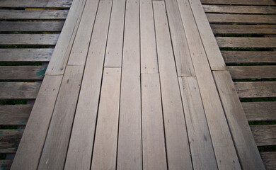 Old wooden floor that is a walkway bridge