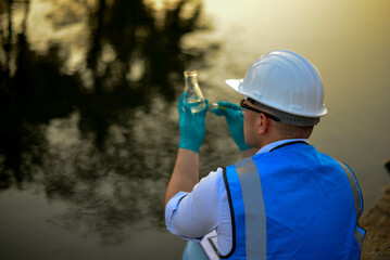 An environmental expert is conducting a thorough examination of the contaminants and aquatic life...