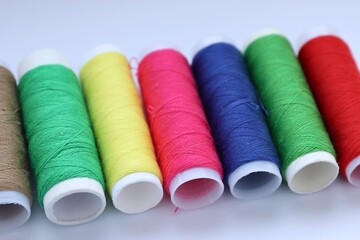 spools of thread, needlework, colored thread, spools of thread on a white background, 