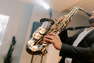 Man plays saxophone, classical jezz music, concert