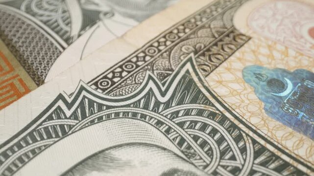 Extreme close-up of a 10,000-tugrik Mongolian banknotes in  motion, highlighting intricate details and texture.