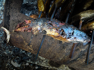smoked fish on display by fishermen