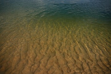 Rippled sand patterns under the water surface. Natural pattern background. Zambezi river, Namibia.