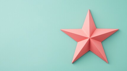 Obraz premium A geometric star design in coral color against a soft mint background, perfect for modern decor or graphic projects.