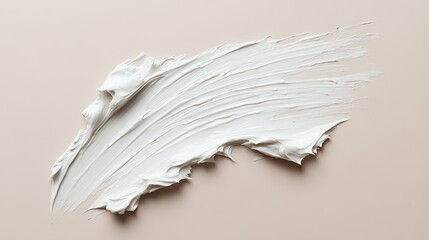 A smear of white beauty cream on a neutral background, showing the smoothness and spreadability of the product.